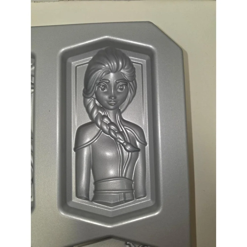 Nordic Ware Disney Frozen 2 character cakelet pan is made of heavy cast aluminum